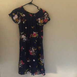 A navy blue dress with flowers on it